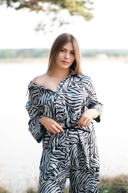 Lovely girl in summer dress at the sea