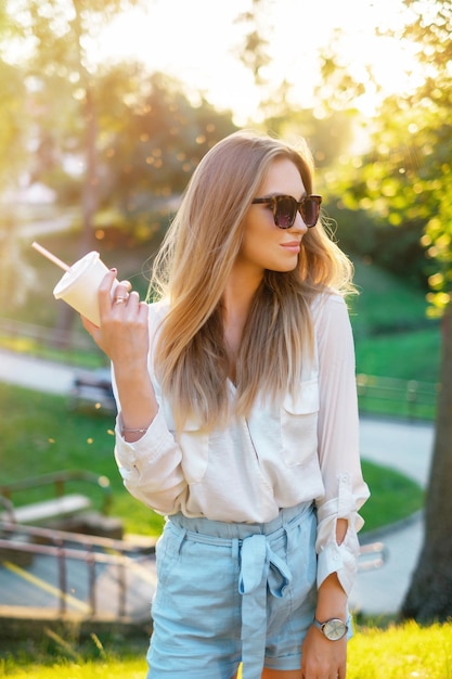 Lovely girl in sunglasses outdoors