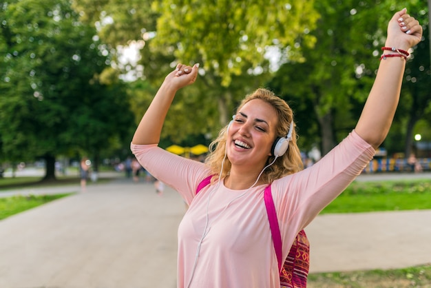 Lovely girl with headphones enjoying her time