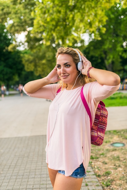 Lovely girl with headphones enjoying her time