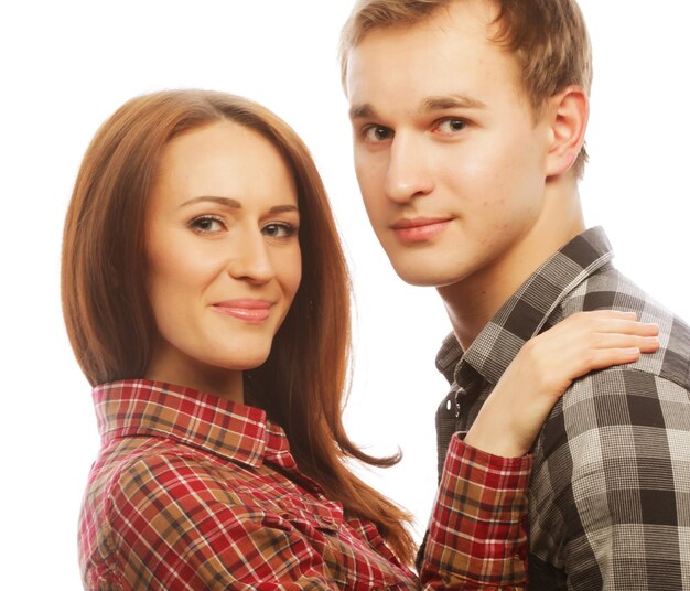 Photo lovely happy couple hugging over white background