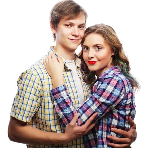 Photo lovely happy couple hugging over white background