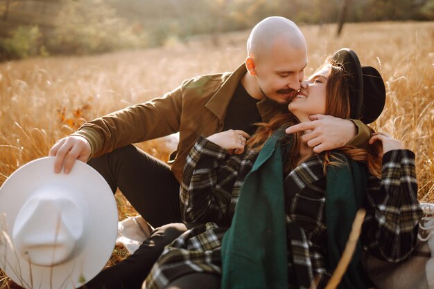 Premium Photo | Lovely hipster couple enjoying each other in the autumn  park nice autumn day love and lifestyle