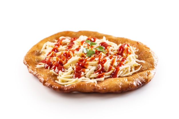 Lovely hungarian traditional langos served with grated cheese, ketchup, gaerlic and green herb.