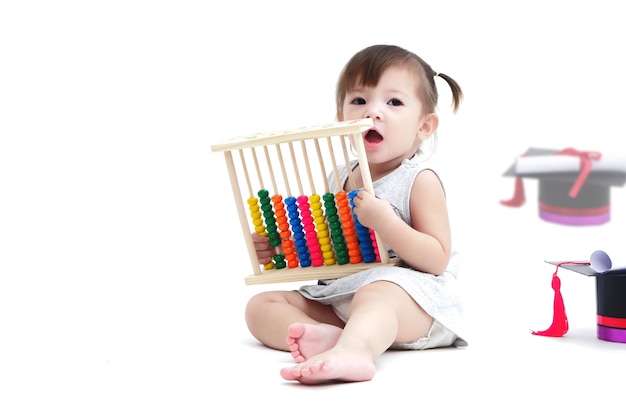 The lovely kid playing with abacus 