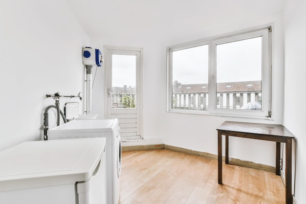 Lovely laundry room with a large window