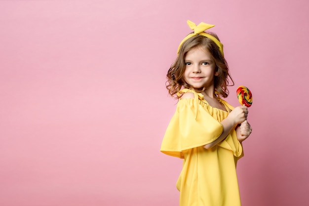 Lovely little girl with candy