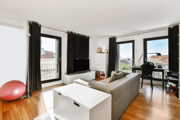 Lovely little living room with grey sofa