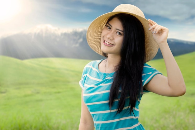 Lovely model with hat in nature