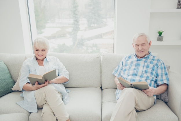 Lovely older couple posing together on the couch