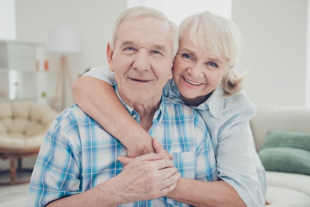 Lovely older couple posing together indoors