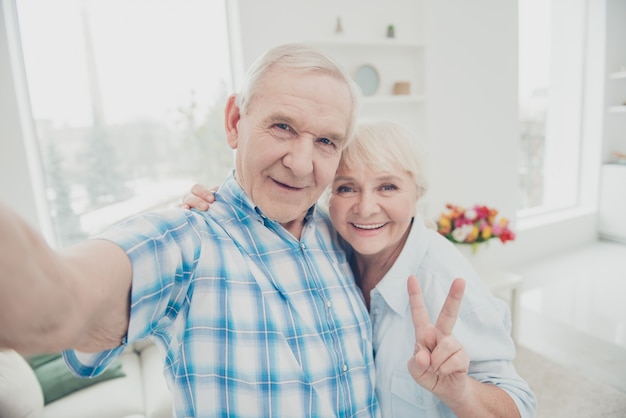 Lovely older couple posing together indoors