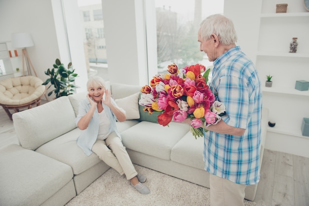 Lovely older couple posing together indoors