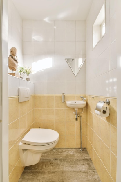 Lovely restroom with beige tiles