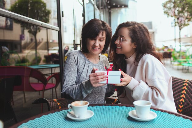 Lovely woman makes a present for her mom