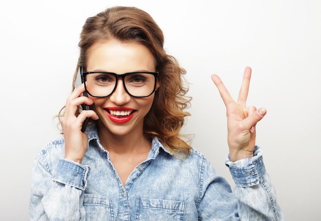 Lovely woman showing victory or peace sign