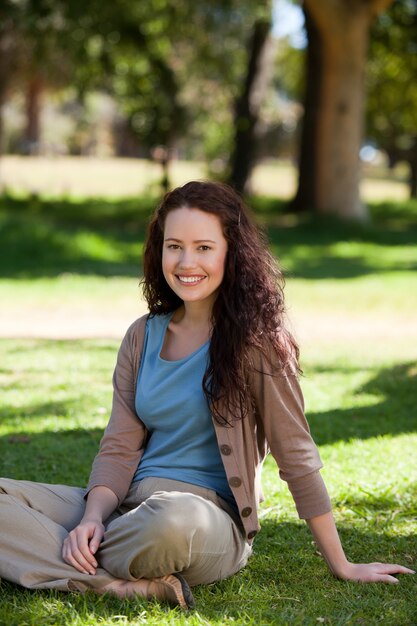 Lovely woman sitting in the garden