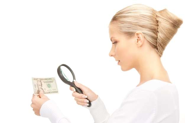 lovely woman with magnifying glass and money