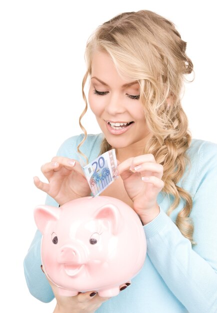 lovely woman with piggy bank and money