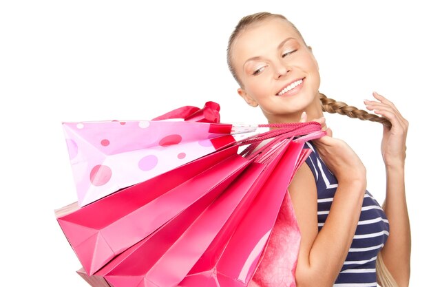 lovely woman with shopping bags over white