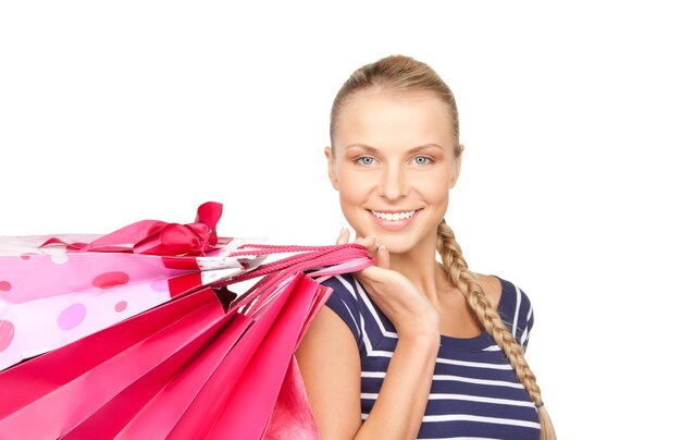 lovely woman with shopping bags over white