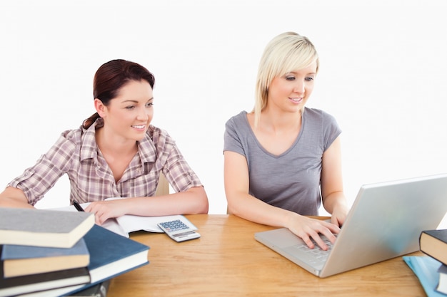 Lovely women learning at table