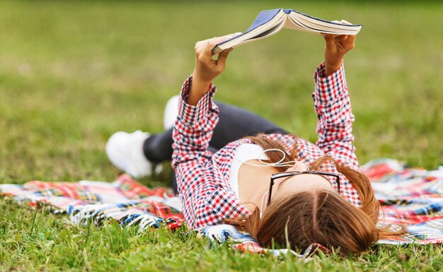 Lovely young girl in plaid shirt