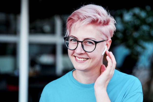 lovely young millennial girl listening to music