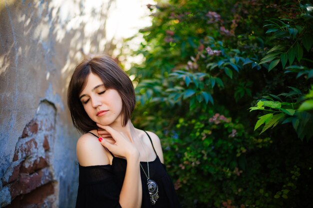 Lovely young woman posing in the city.