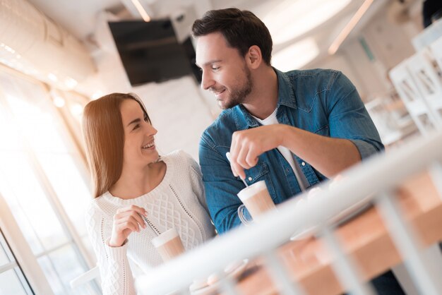 Lovers Drink Latte Romantic Date in Cozy Cafe.