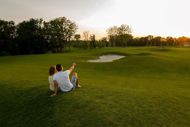 Lovers enjoy each other romantic trip walking in the mountains guy and girl hugging in the park even...