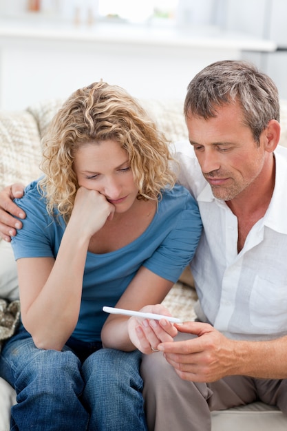 Lovers looking at a pregnancy test 