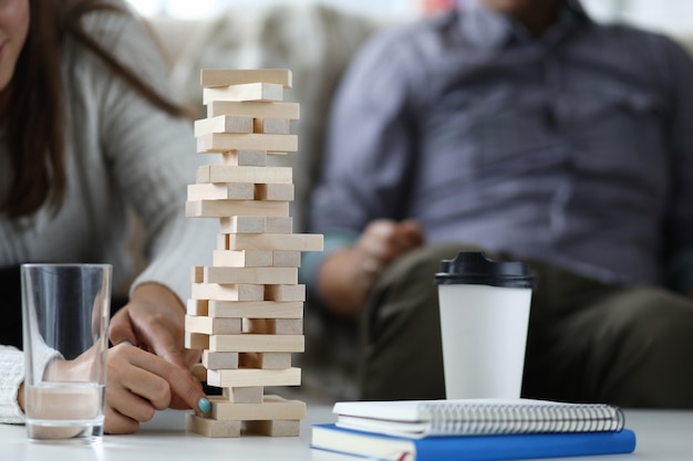 Lovers playing Jenga wooden game