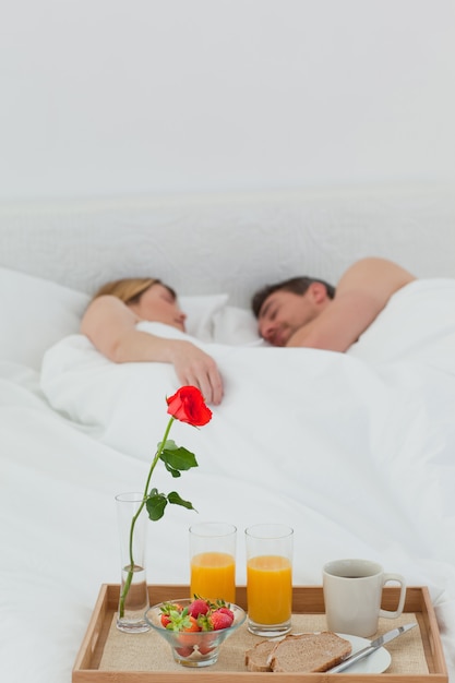 Lovers sleeping after having breakfast