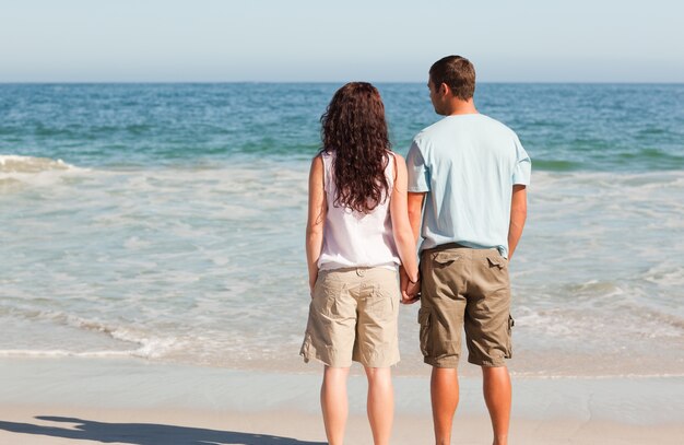 Lovers walking on the beach