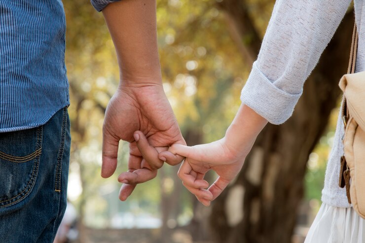 Photo lovers walking hand in hand