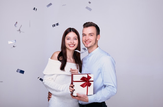 Lovers with a gift on New Year's Eve.