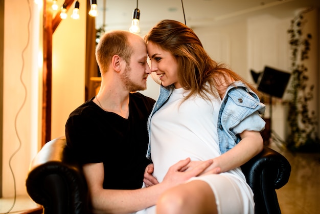 A loving couple in anticipation of the birth of a child.