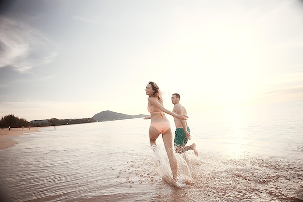 loving couple on the beach / summer vacation, sea coast, love, romantic vacation at sea