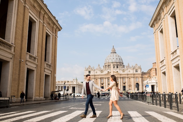 Loving couple crossing the street in Rome