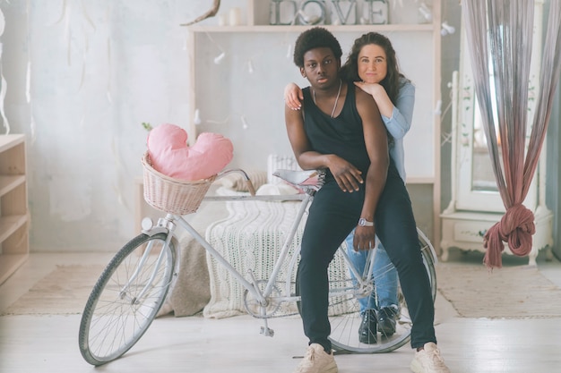 Loving couple embracing with a bicycle