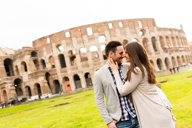 Loving couple in front of the Colosseum in Rome