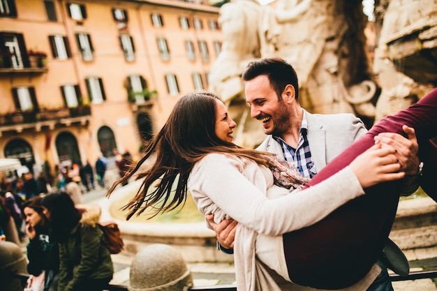 Loving couple having fun in Rome, Italy