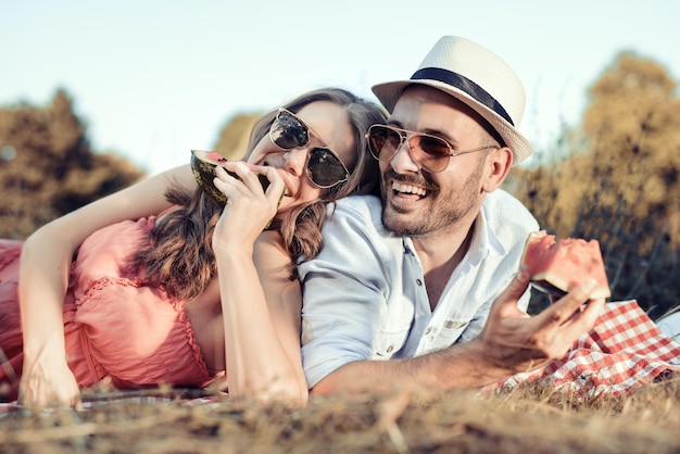 Loving couple having a picnic in the summer