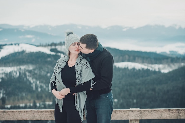 Loving couple hugging at the top of the mountain in the Ukrainian Carpathians