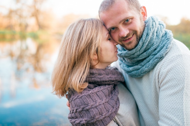 Loving couple in knitted clothes romantic portrait