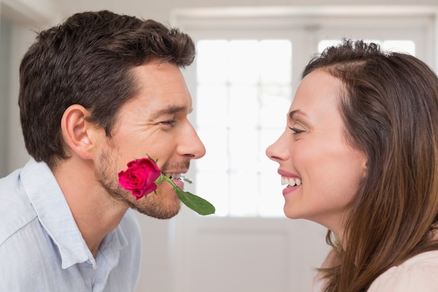 Loving couple looking at each other at home