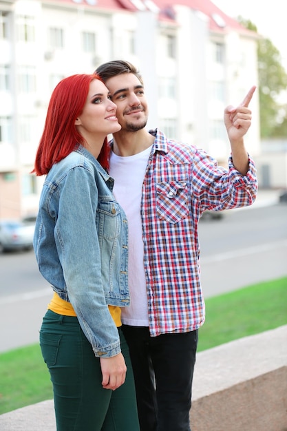 Loving couple near apartment house