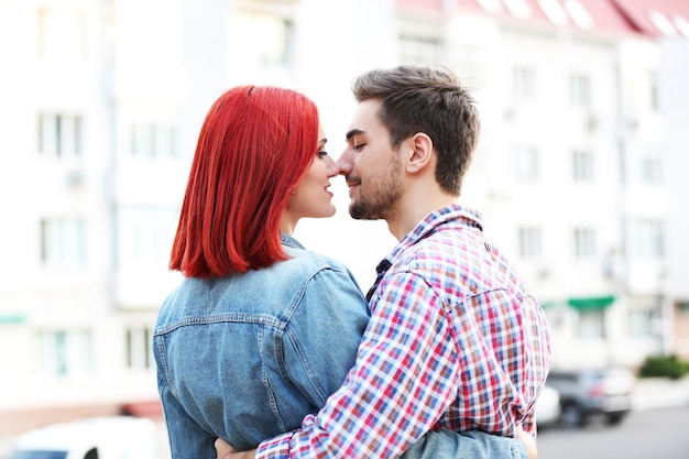 Loving couple near apartment house