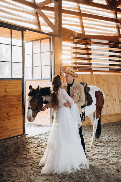 Loving couple on a ranch in the west in the winter season